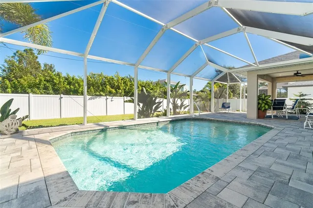 a view of a swimming pool with a patio