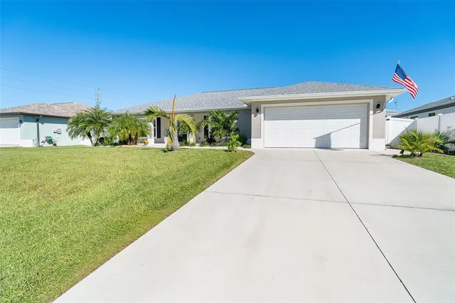 a view of backyard with outdoor seating and green space