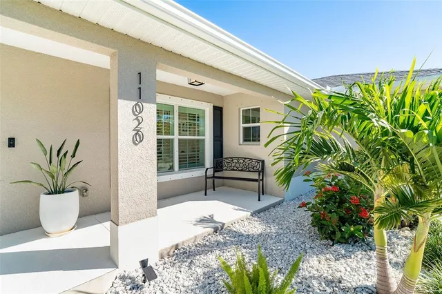 a view of a chairs and table in a patio