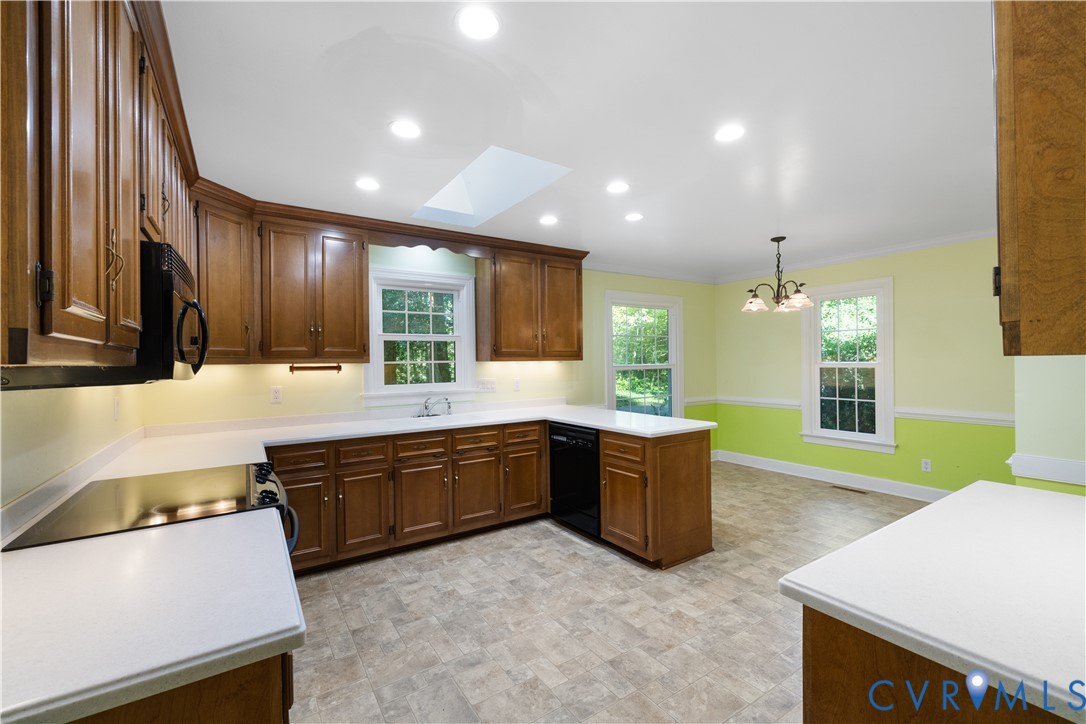 8939 Cardiff Road North Chesterfield, VA 23236 - Photo 11 of 45 Kitchen featuring a skylight, crown molding, light