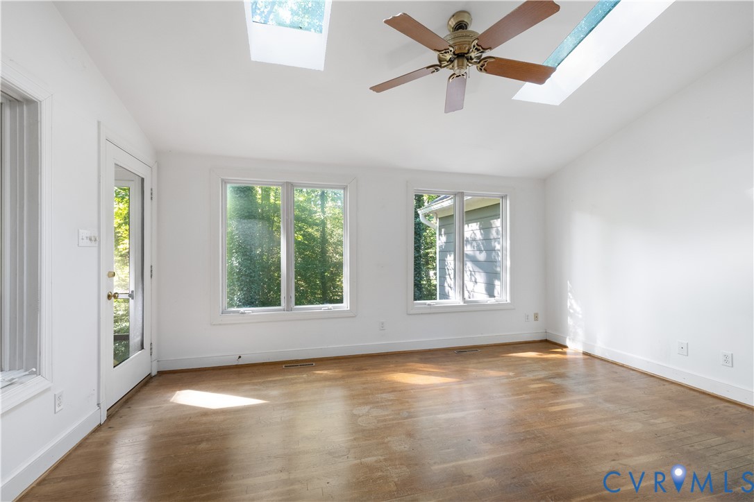 8939 Cardiff Road North Chesterfield, VA 23236 - Photo 16 of 45 Unfurnished room featuring vaulted ceiling, wood f