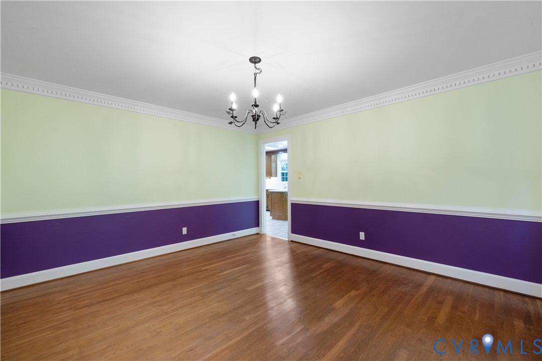 8939 Cardiff Road North Chesterfield, VA 23236 - Photo 21 of 45 Unfurnished room with crown molding, a chandelier,