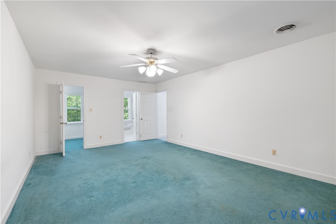 8939 Cardiff Road North Chesterfield, VA 23236 - Photo 24 of 45 Carpeted empty room featuring baseboards and a cei