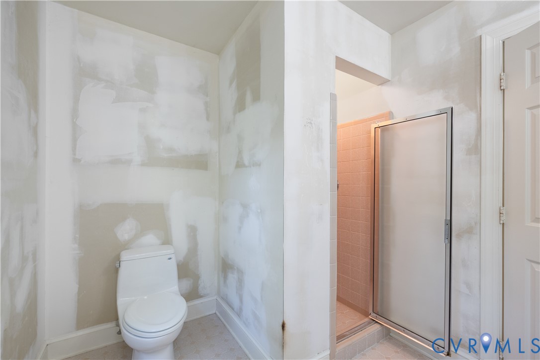 8939 Cardiff Road North Chesterfield, VA 23236 - Photo 27 of 45 Full bathroom featuring a stall shower and toilet