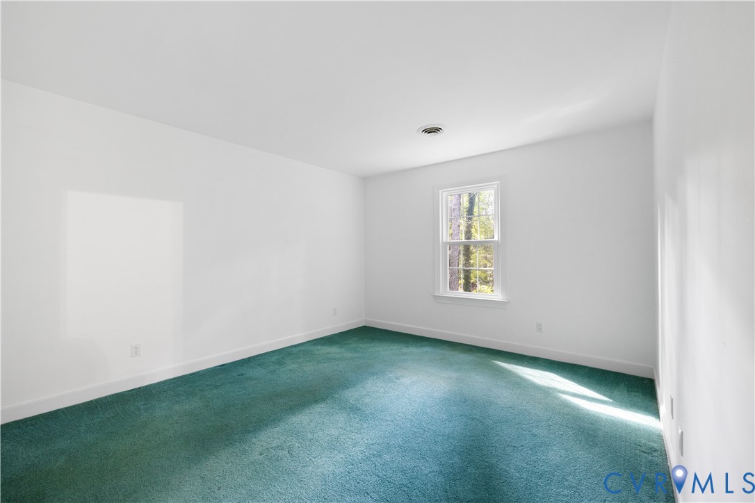 8939 Cardiff Road North Chesterfield, VA 23236 - Photo 34 of 45 Carpeted empty room with baseboards