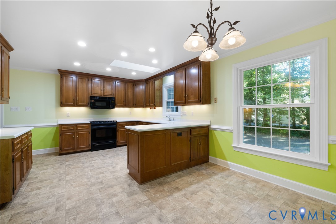 8939 Cardiff Road North Chesterfield, VA 23236 - Photo 10 of 45 Kitchen featuring black appliances, a peninsula, p