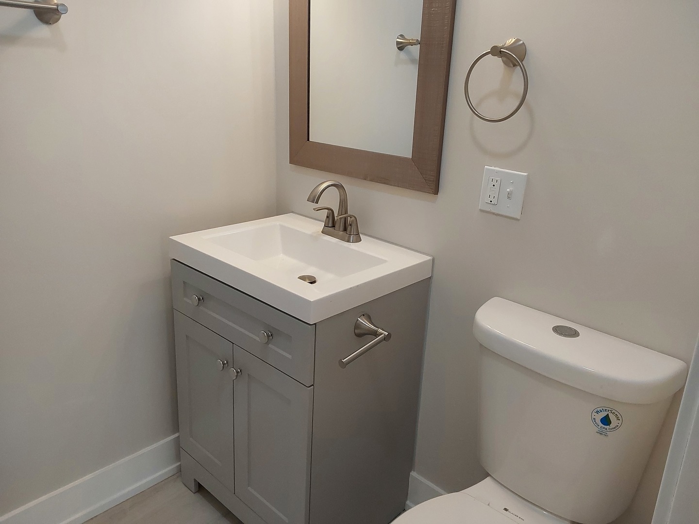 722 East Indiana Street Wheaton, IL 60187 - Photo 11 of 16 a bathroom with a sink a toilet and a mirror