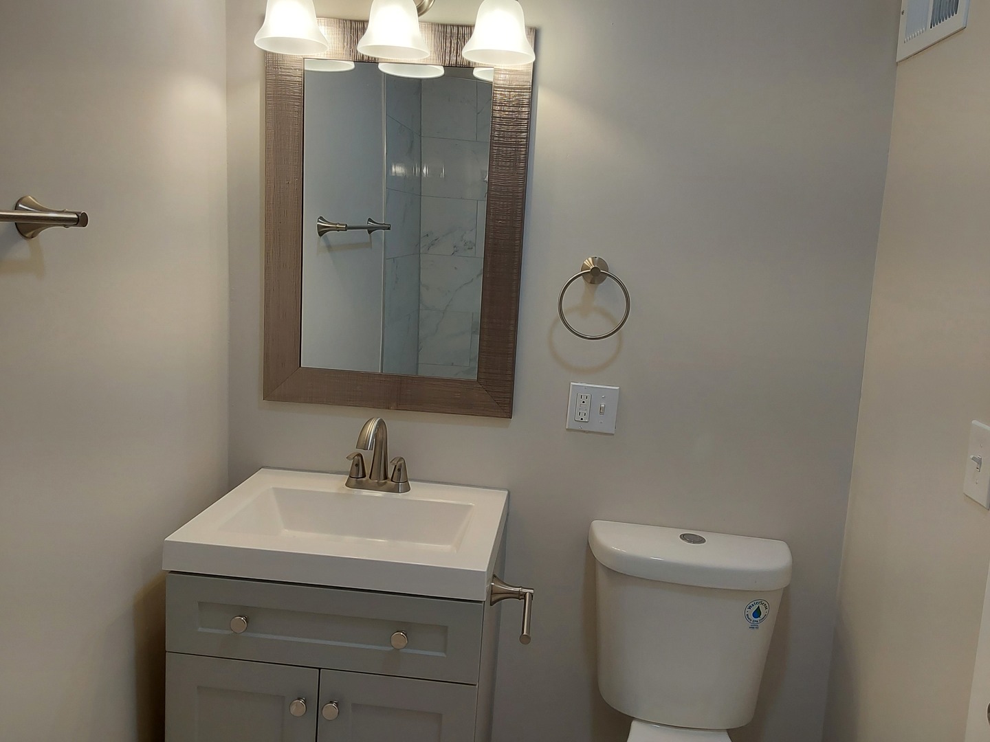 722 East Indiana Street Wheaton, IL 60187 - Photo 12 of 16 a bathroom with a toilet sink and mirror