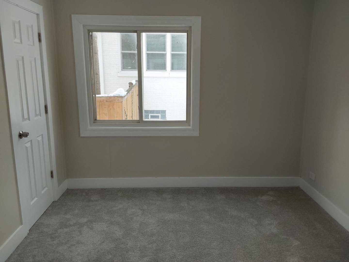 722 East Indiana Street Wheaton, IL 60187 - Photo 10 of 16 an empty room with a window