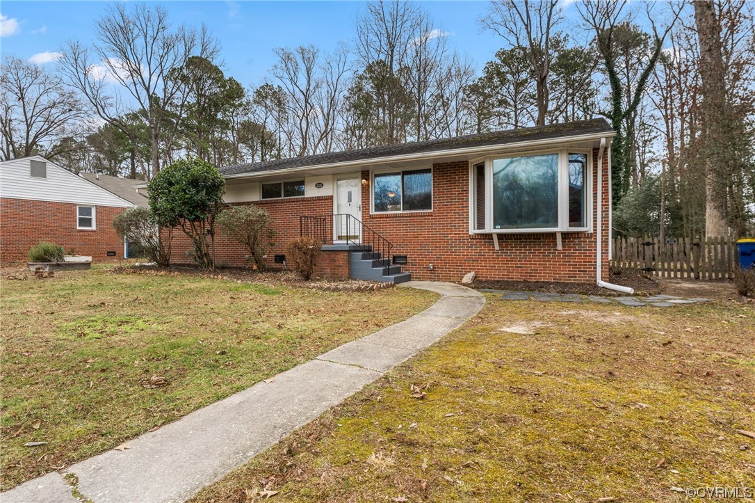 1221 Woodcroft Road Richmond, VA 23235 - Photo 2 of 42 a view of a house with a yard
