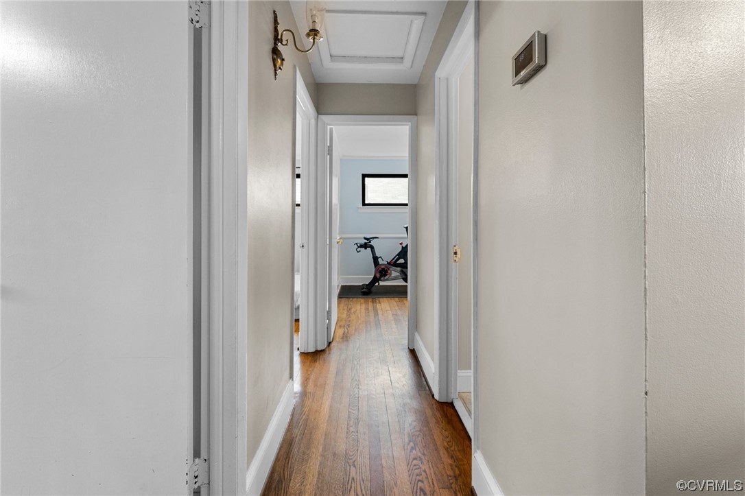 1221 Woodcroft Road Richmond, VA 23235 - Photo 22 of 42 a view of a hallway with wooden floor and closet
