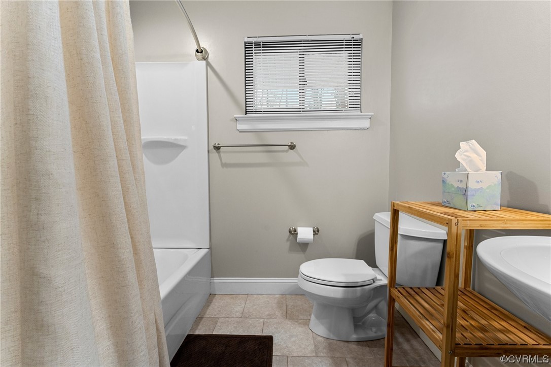 1221 Woodcroft Road Richmond, VA 23235 - Photo 23 of 42 a bathroom with a toilet and a shower