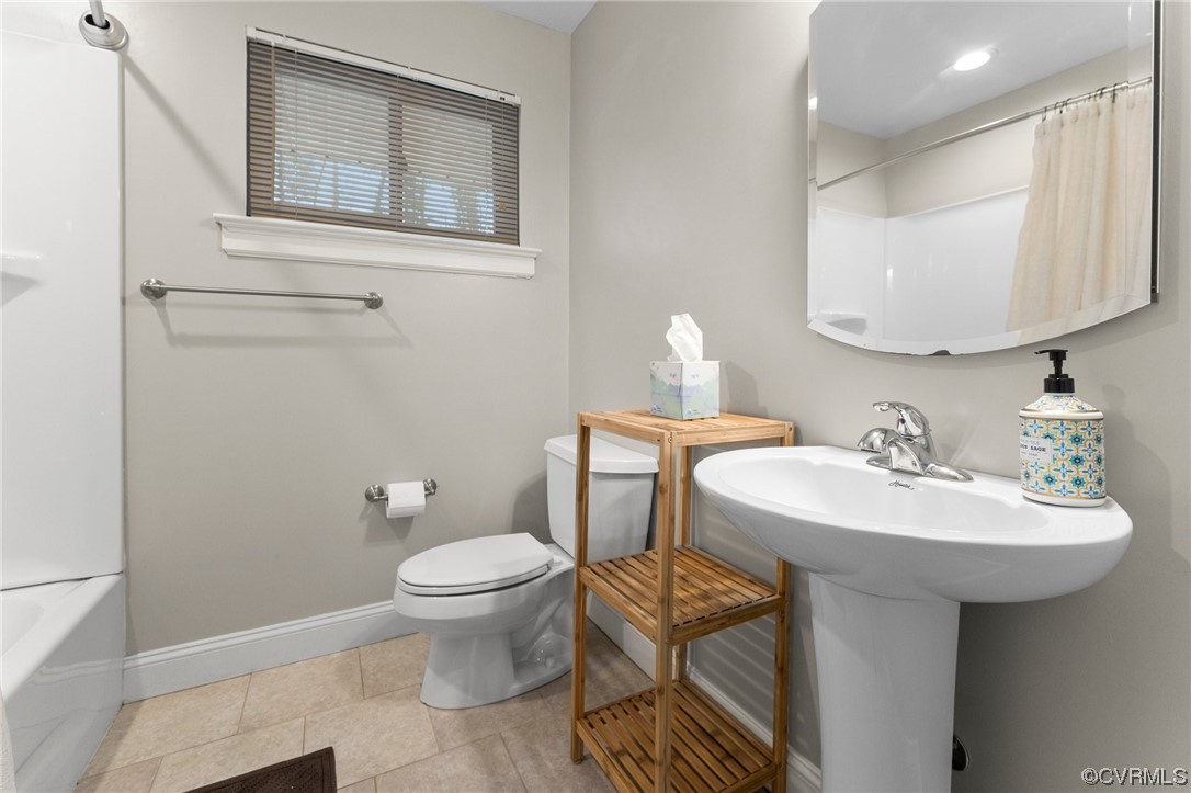 1221 Woodcroft Road Richmond, VA 23235 - Photo 24 of 42 a bathroom with a toilet sink and mirror