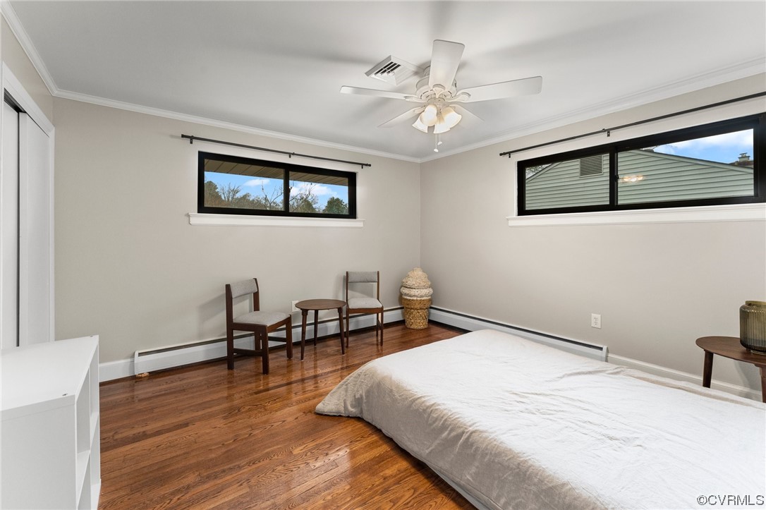 1221 Woodcroft Road Richmond, VA 23235 - Photo 26 of 42 a bedroom with a bed and a desk