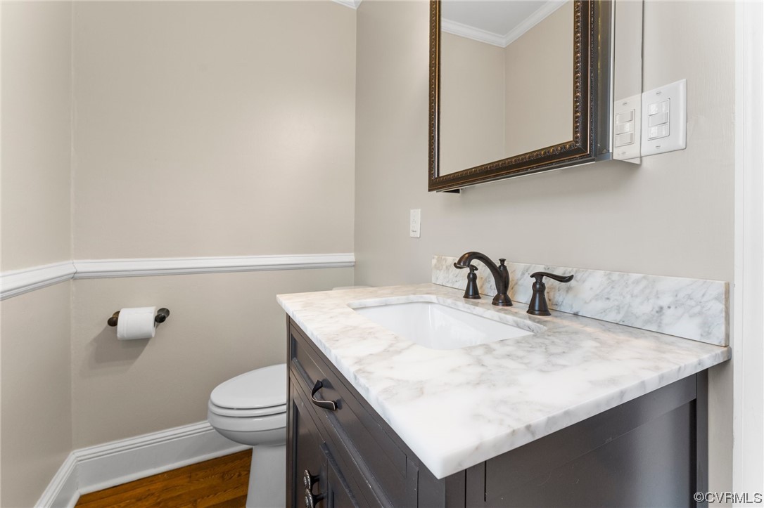 1221 Woodcroft Road Richmond, VA 23235 - Photo 31 of 42 a bathroom with a granite countertop sink a toilet and mirror