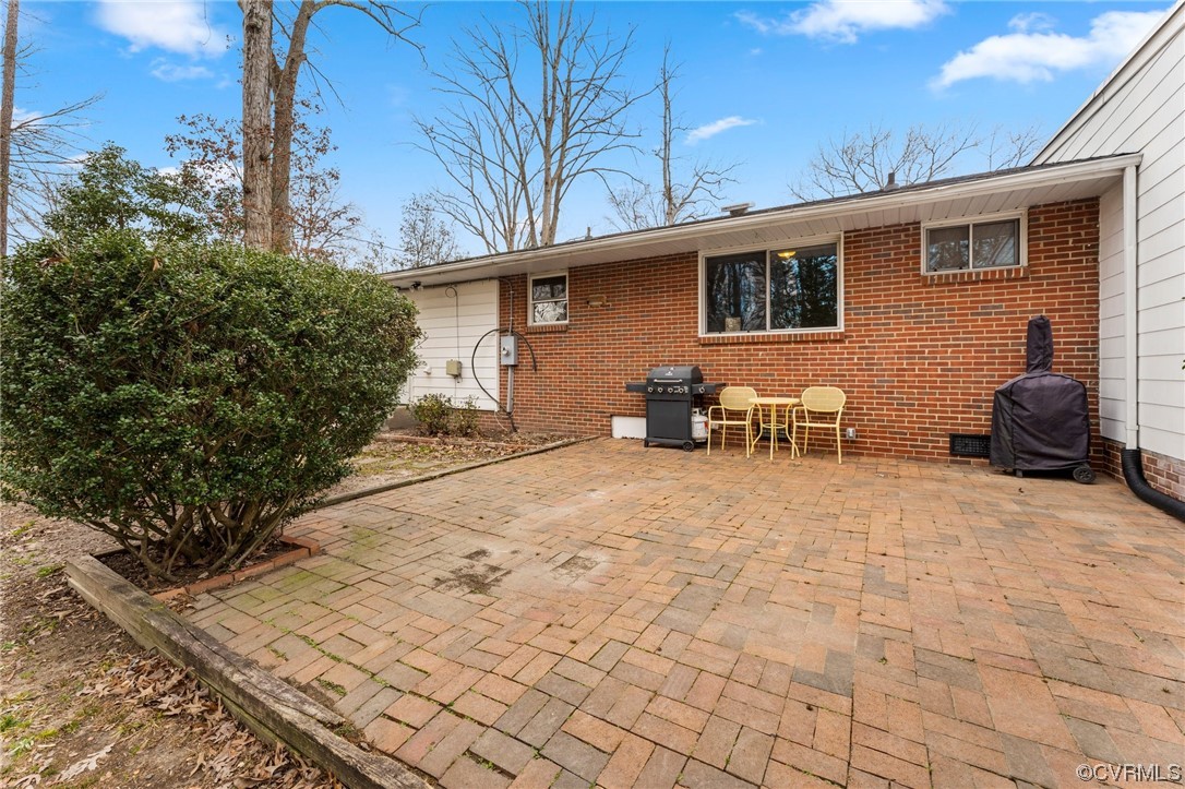 1221 Woodcroft Road Richmond, VA 23235 - Photo 35 of 42 a backyard of a house with table and chairs