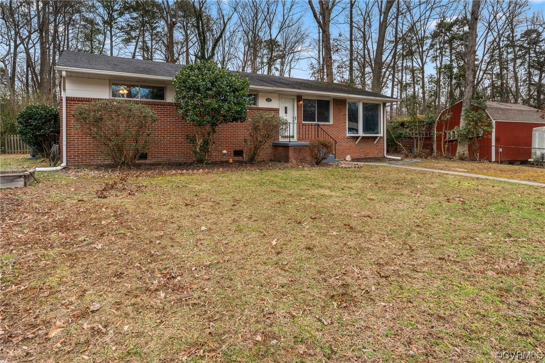 1221 Woodcroft Road Richmond, VA 23235 - Photo 40 of 42 front view of a house with a yard