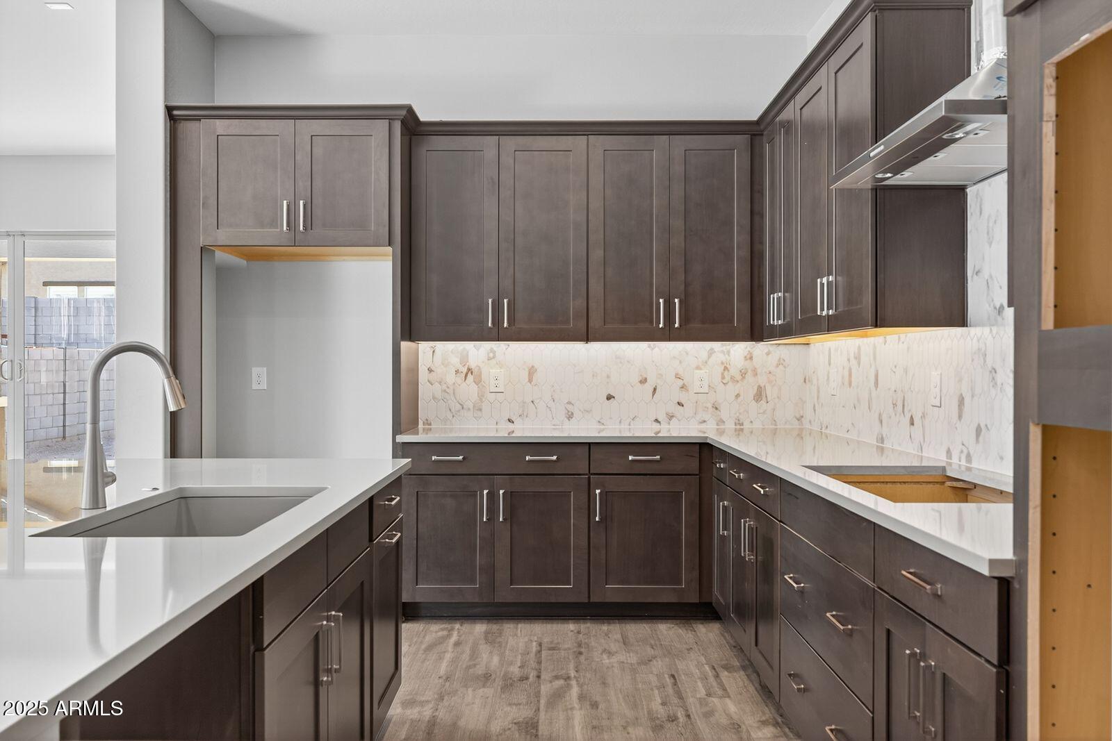 3191 West Santa Rosa Road San Tan Valley, AZ 85144 - Photo 15 of 52 a kitchen with a sink and cabinets