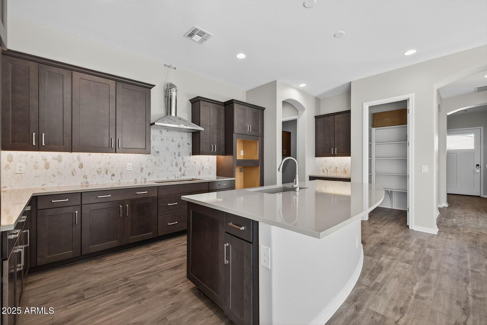 3191 West Santa Rosa Road San Tan Valley, AZ 85144 - Photo 16 of 52 a kitchen with stainless steel appliances granite countertop a sink stove and refrigerator