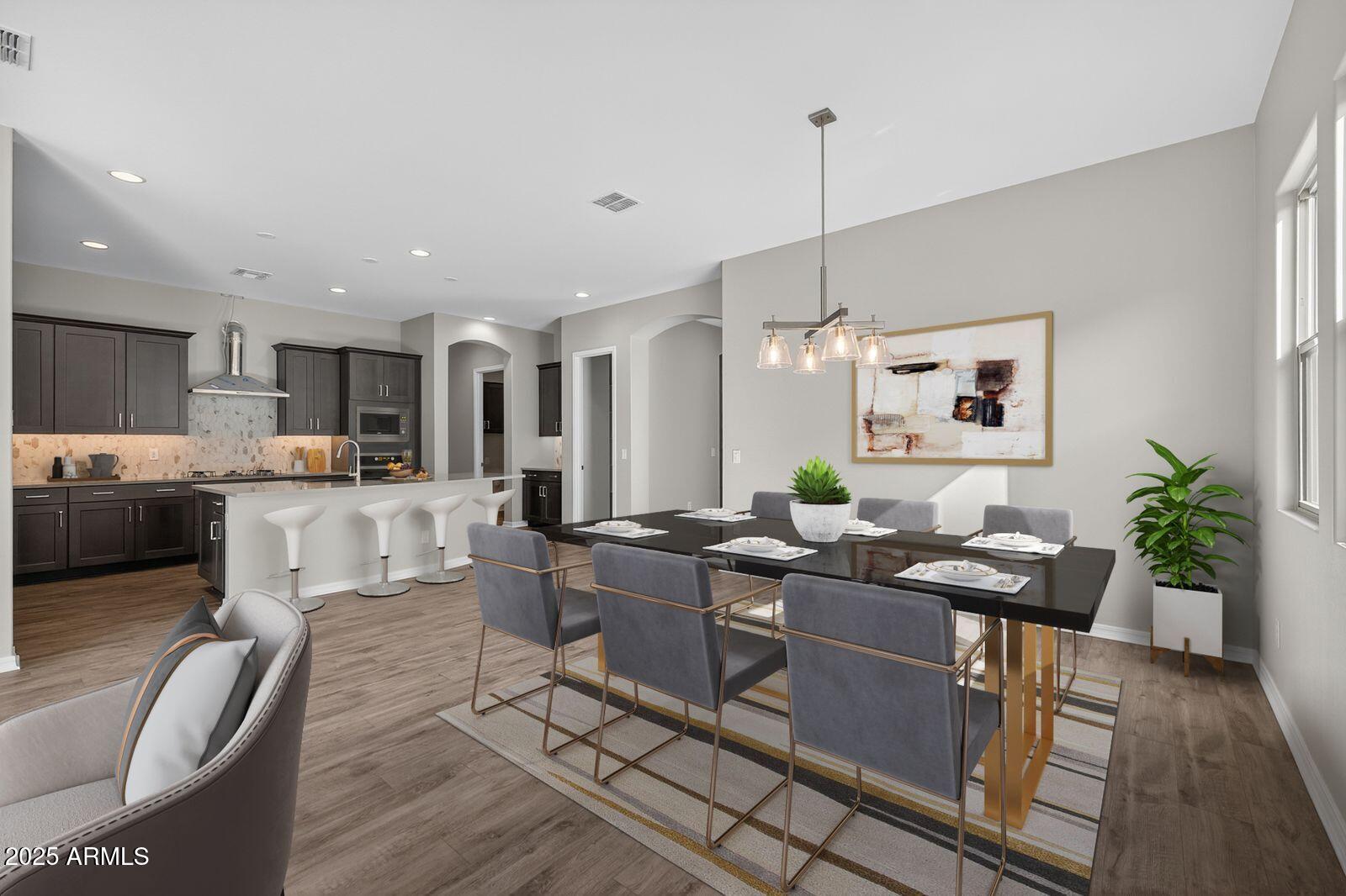 3191 West Santa Rosa Road San Tan Valley, AZ 85144 - Photo 18 of 52 a living room with furniture kitchen view and a chandelier