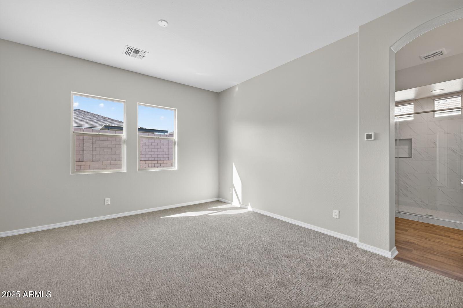 3191 West Santa Rosa Road San Tan Valley, AZ 85144 - Photo 21 of 52 a view of an empty room with a window