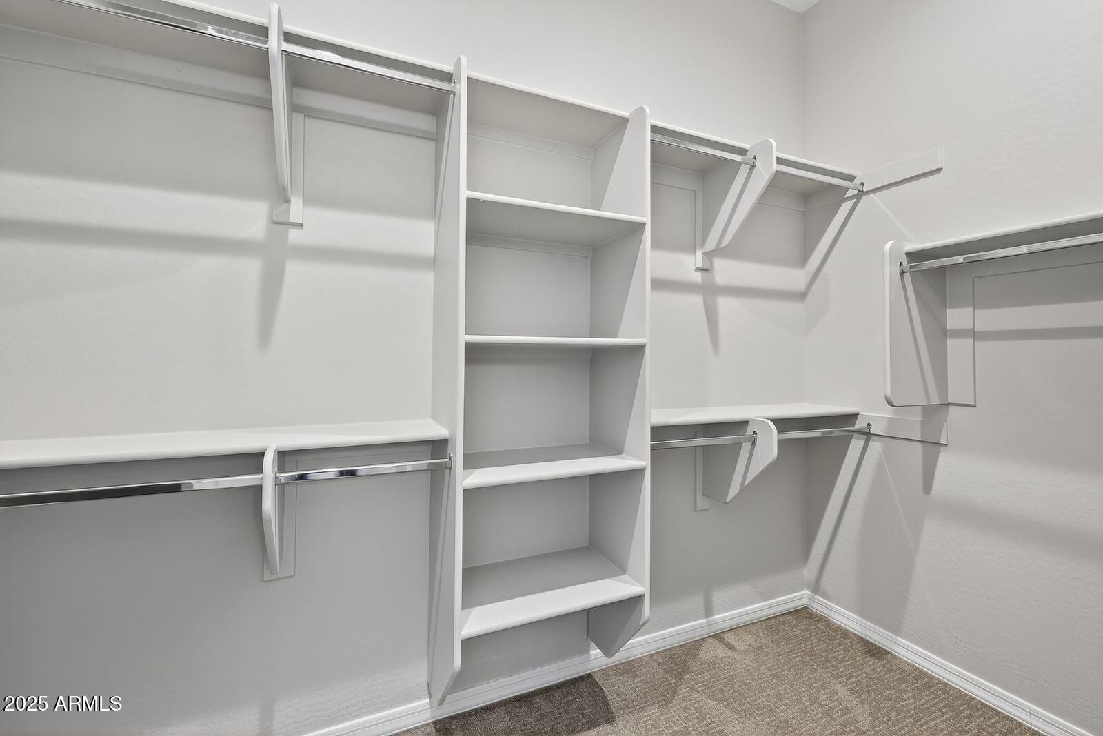 3191 West Santa Rosa Road San Tan Valley, AZ 85144 - Photo 25 of 52 a view of an empty walk in closet