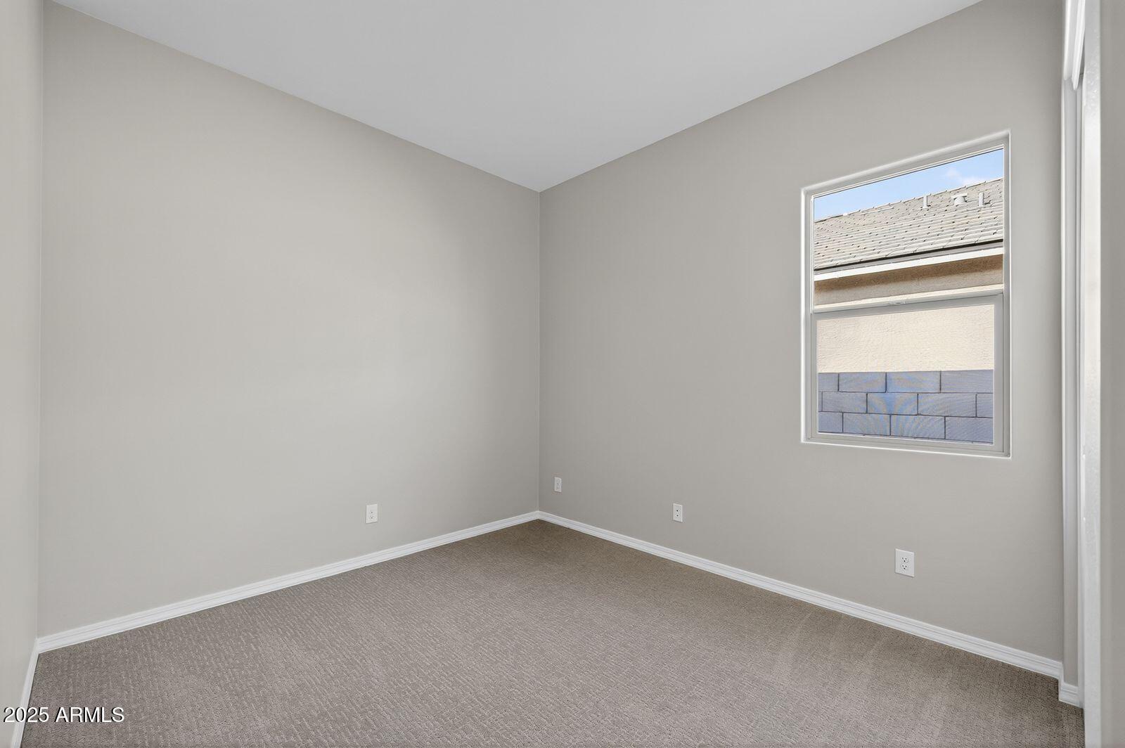 3191 West Santa Rosa Road San Tan Valley, AZ 85144 - Photo 27 of 52 an empty room with a window
