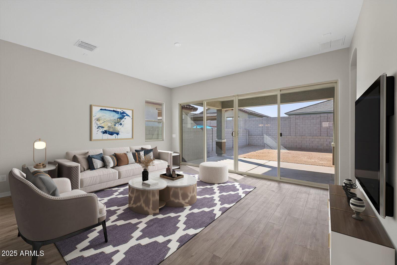 3191 West Santa Rosa Road San Tan Valley, AZ 85144 - Photo 4 of 52 a living room with furniture a large window and a flat screen tv