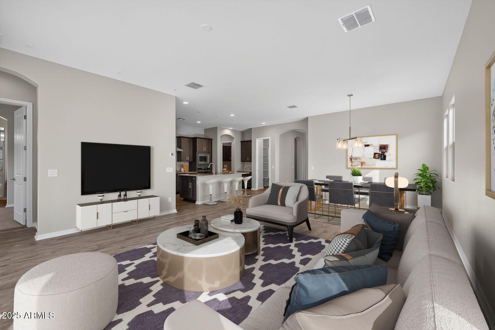 3191 West Santa Rosa Road San Tan Valley, AZ 85144 - Photo 6 of 52 a living room with furniture and a flat screen tv