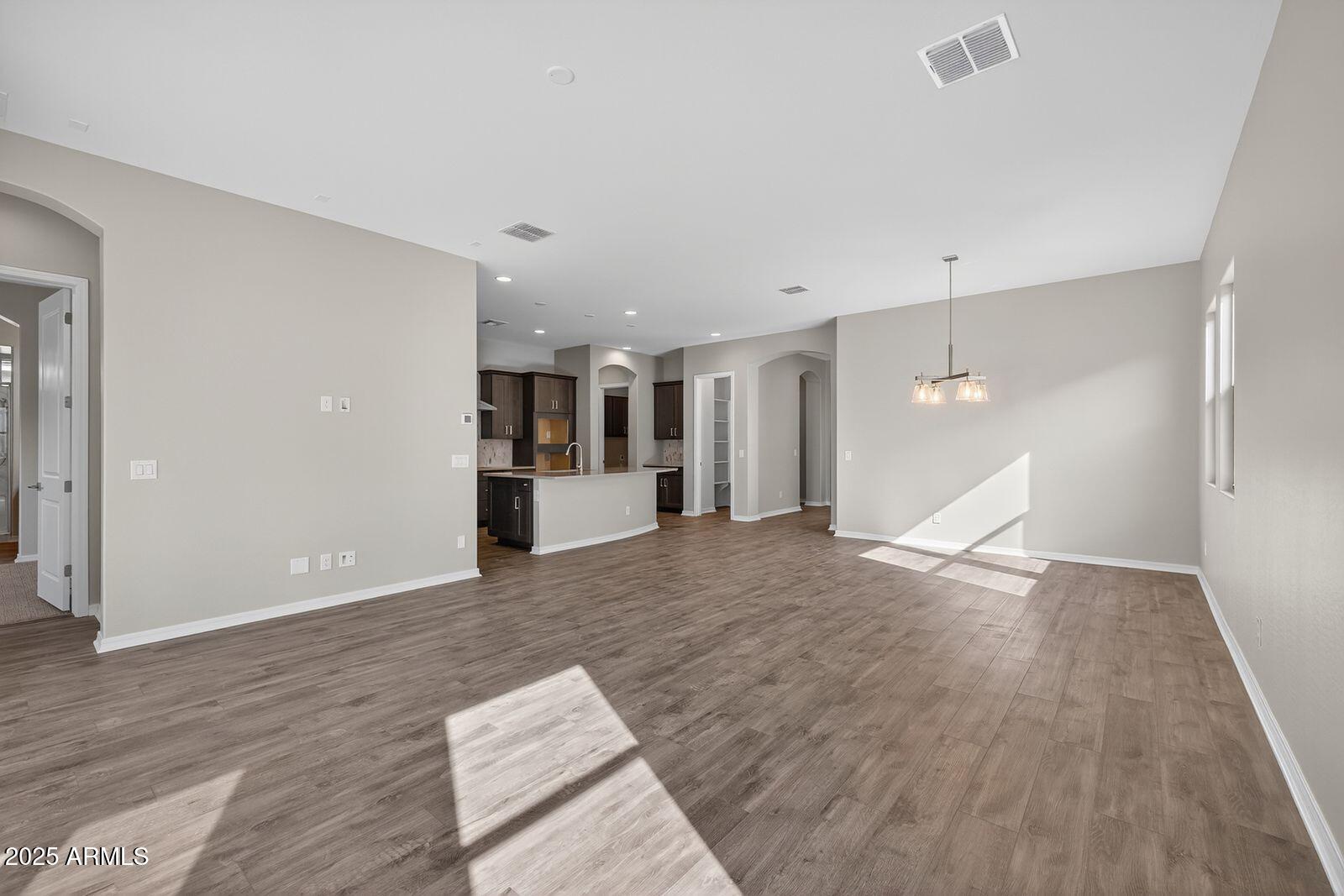 3191 West Santa Rosa Road San Tan Valley, AZ 85144 - Photo 7 of 52 a view of empty room with wooden floor