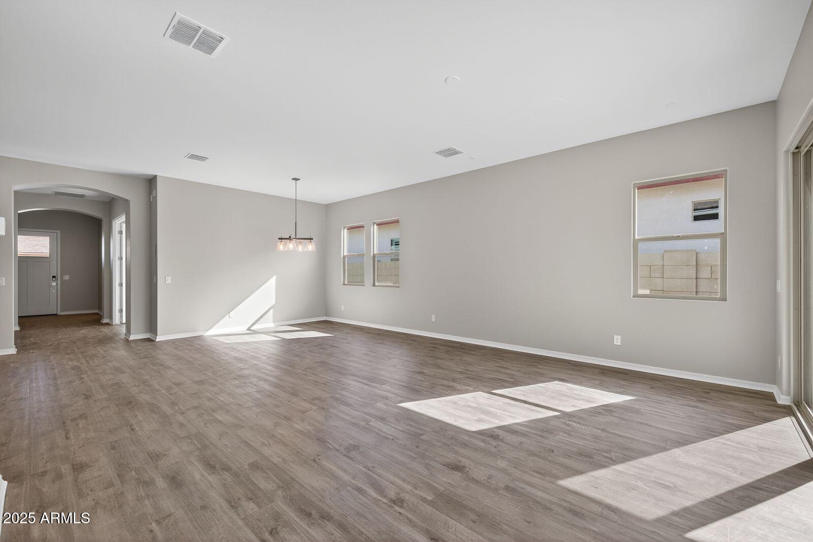 3191 West Santa Rosa Road San Tan Valley, AZ 85144 - Photo 9 of 52 a view of empty room with wooden floor