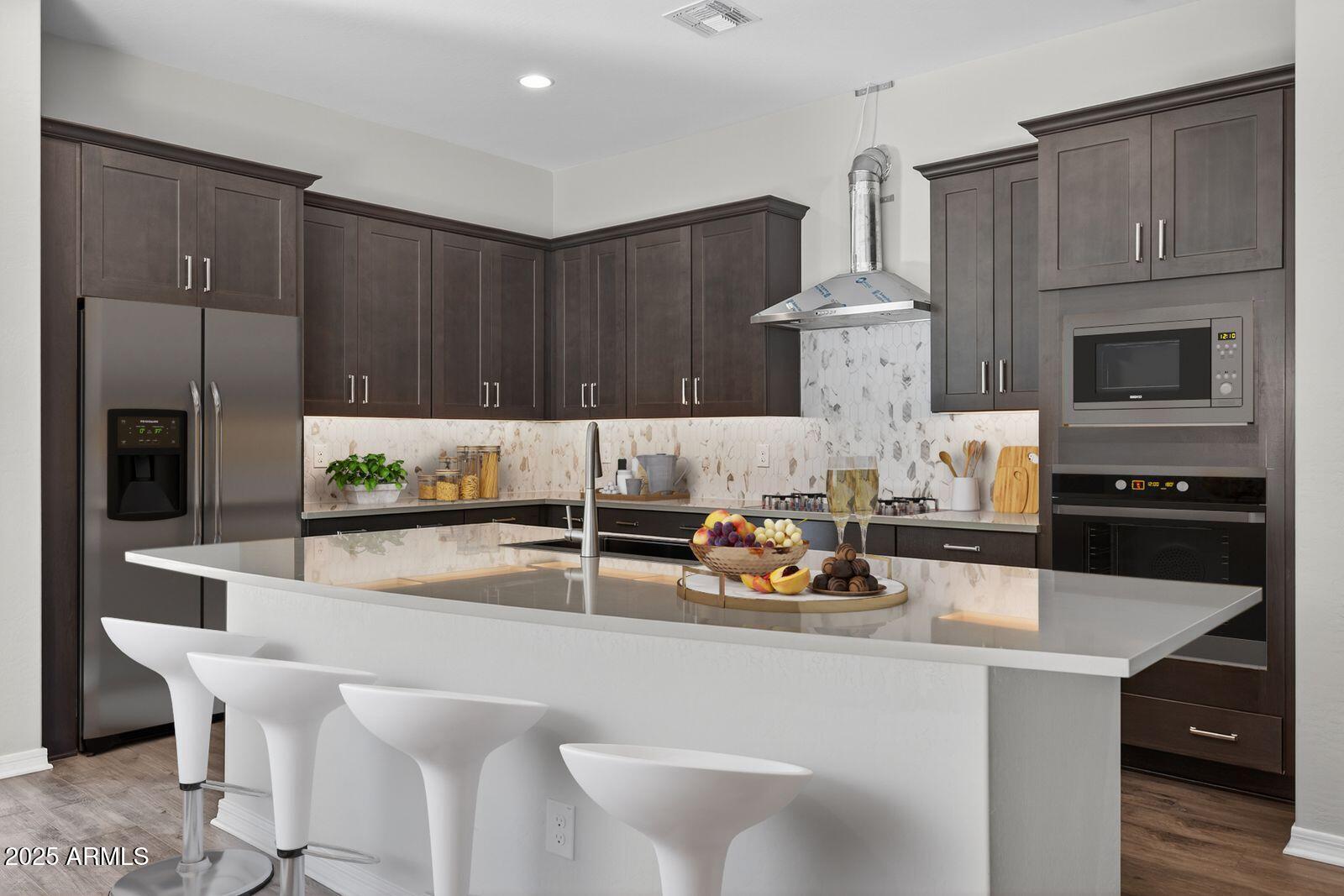3191 West Santa Rosa Road San Tan Valley, AZ 85144 - Photo 10 of 52 a kitchen with a table chairs stove and microwave