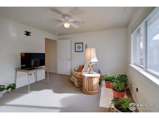 a bathroom with a granite countertop toilet sink and mirror