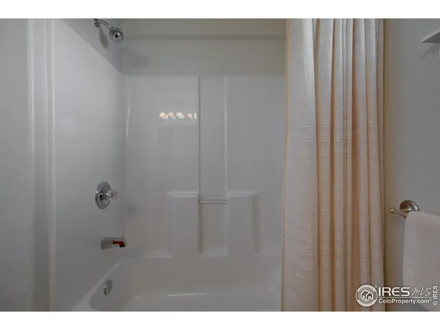 a view of a backyard with plants and lake view