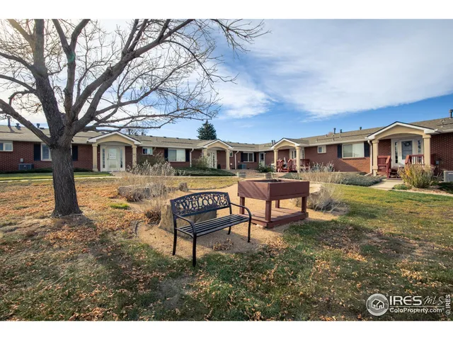 a view of a house with backyard porch and sitting area