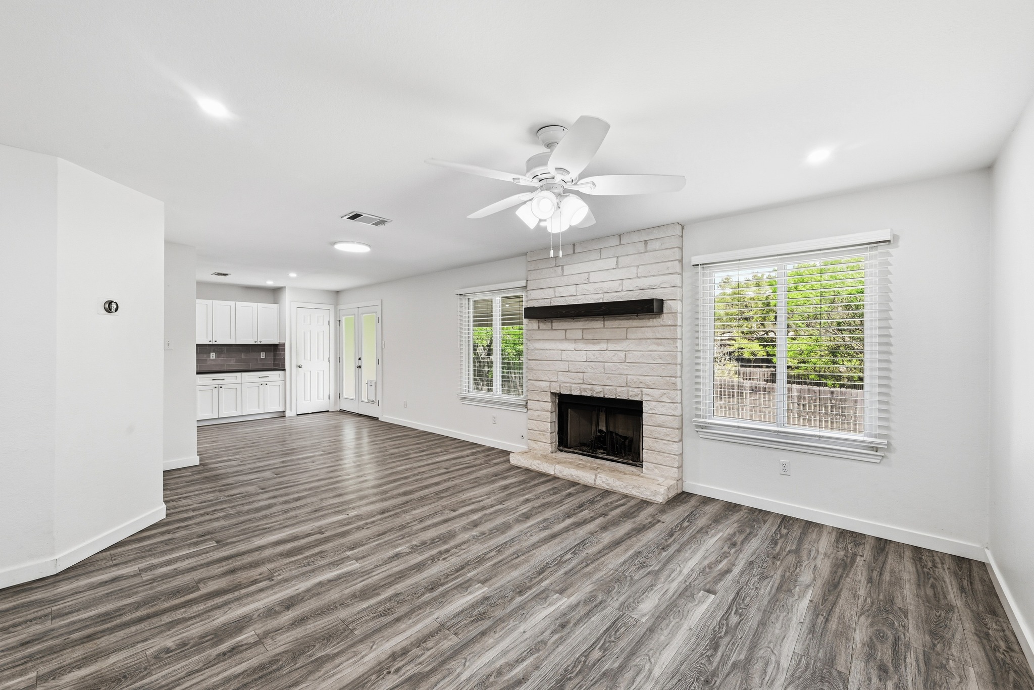 5812 Kayview Drive Austin, TX 78749 - Photo 14 of 31 a view of an empty room with a fireplace and a window