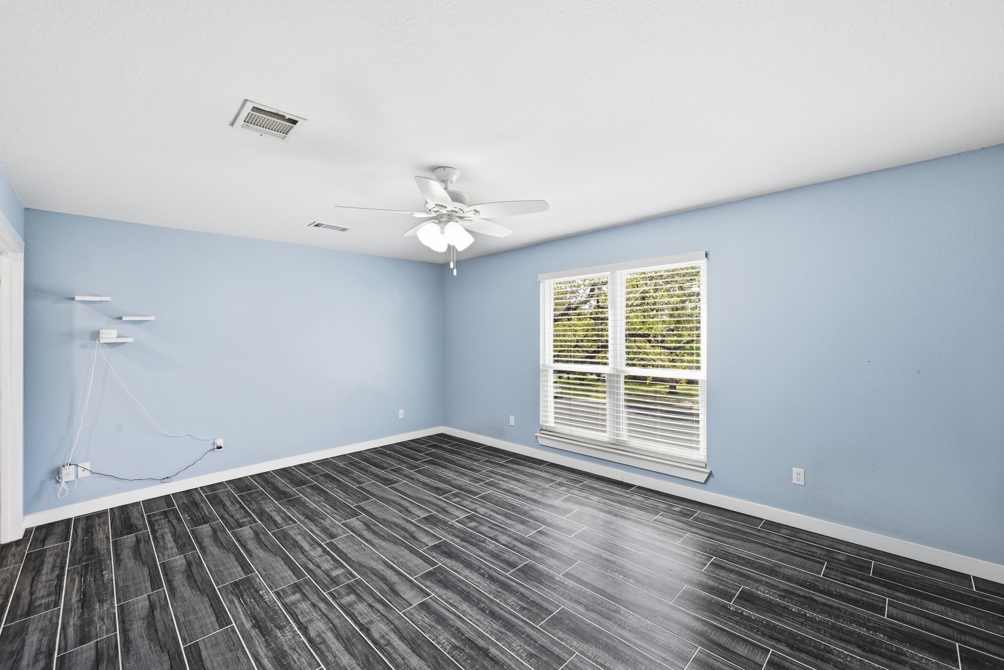 5812 Kayview Drive Austin, TX 78749 - Photo 18 of 31 wooden floor in an empty room with a window