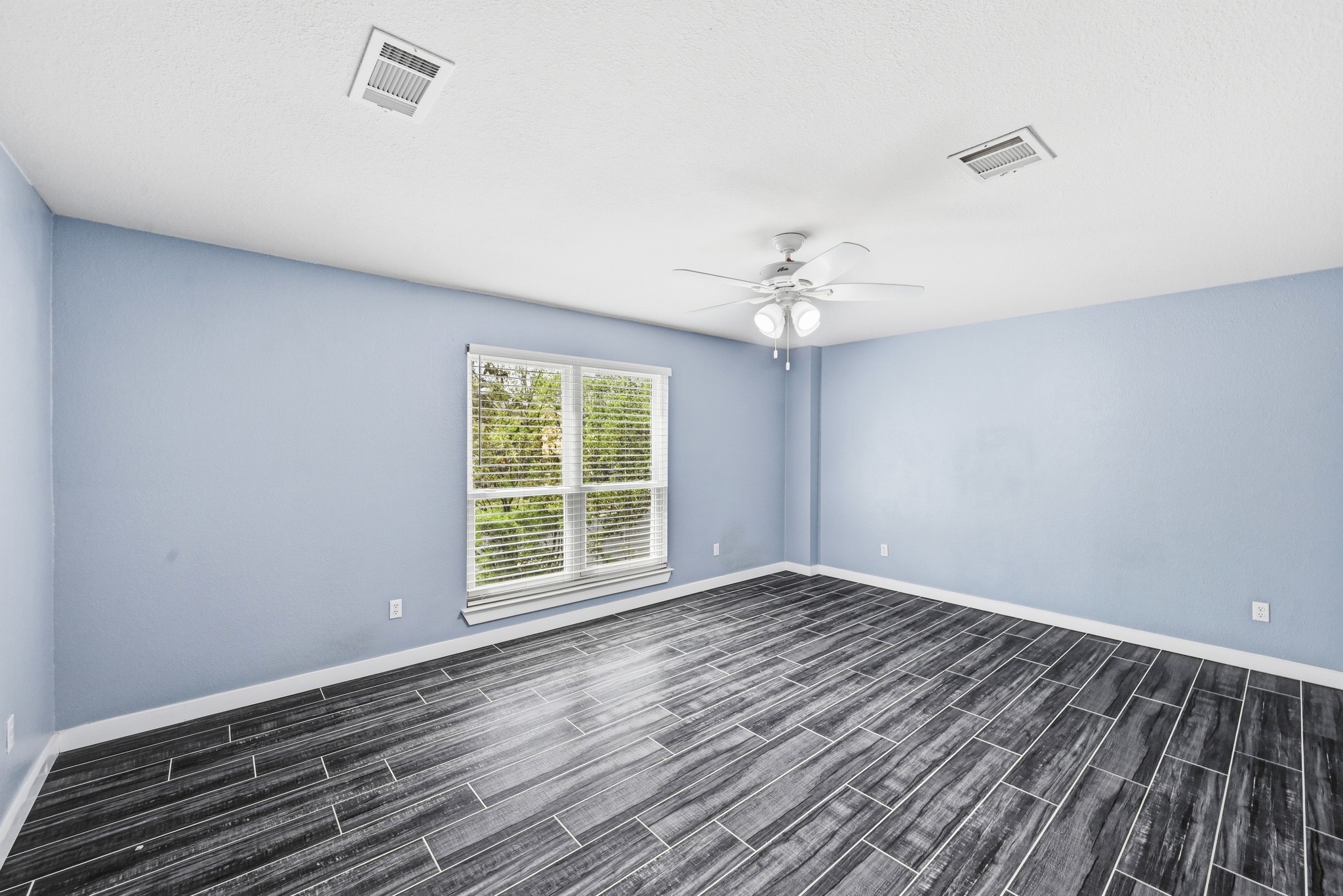 5812 Kayview Drive Austin, TX 78749 - Photo 19 of 31 a view of an empty room with wooden floor and a window
