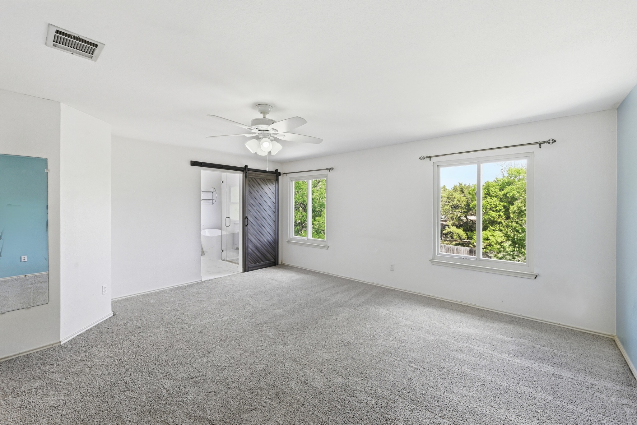 5812 Kayview Drive Austin, TX 78749 - Photo 22 of 31 an empty room with chandelier fan and windows