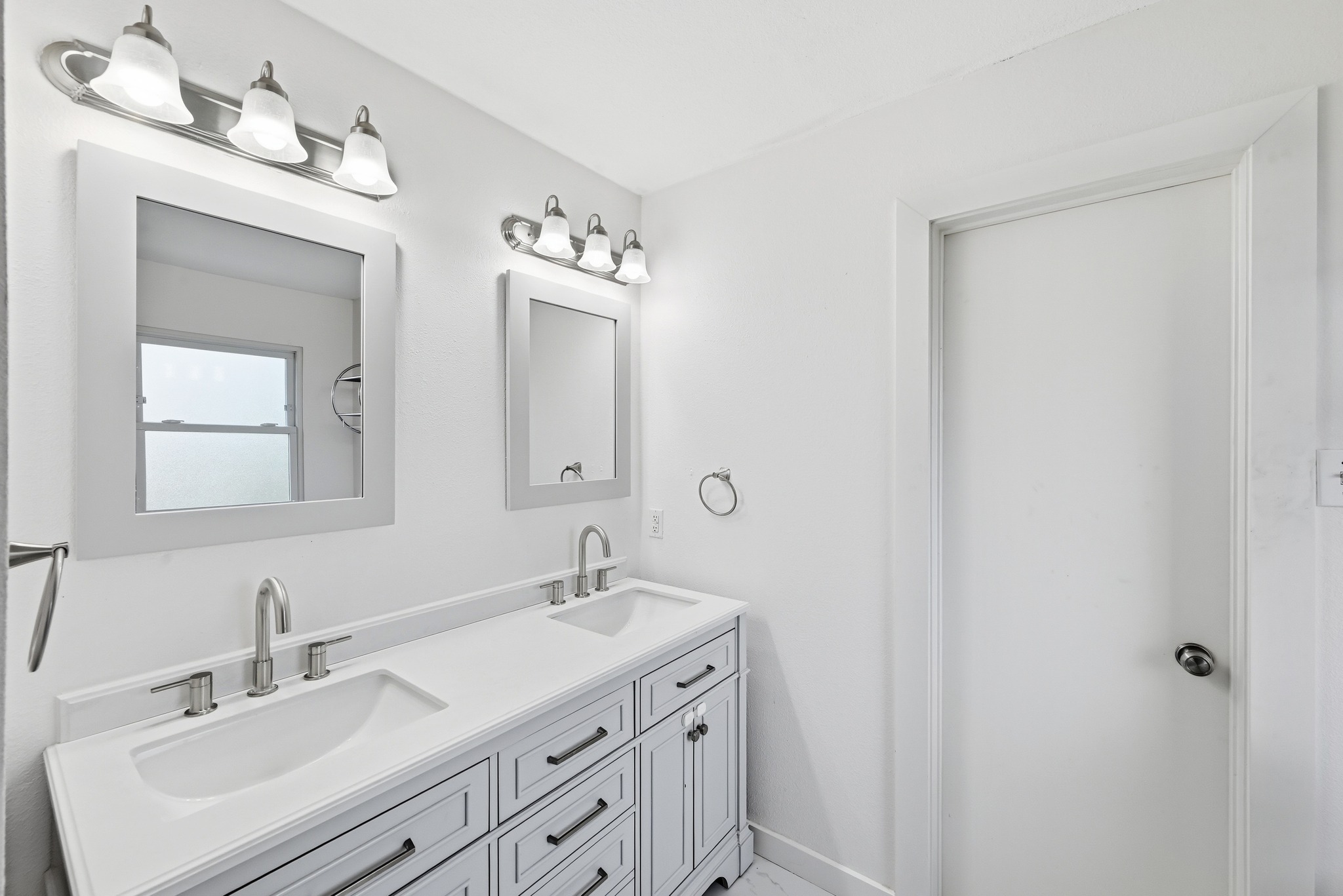 5812 Kayview Drive Austin, TX 78749 - Photo 25 of 31 a bathroom with a sink vanity and mirror