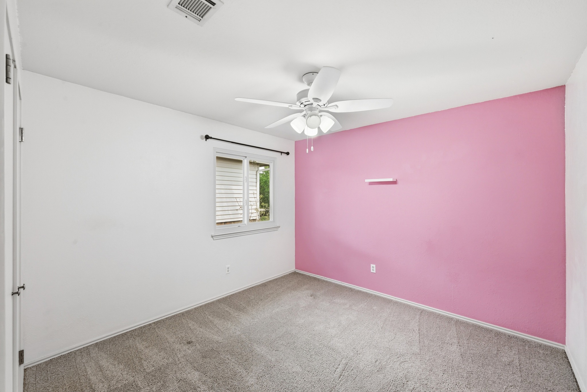 5812 Kayview Drive Austin, TX 78749 - Photo 28 of 31 an empty room with windows and fan