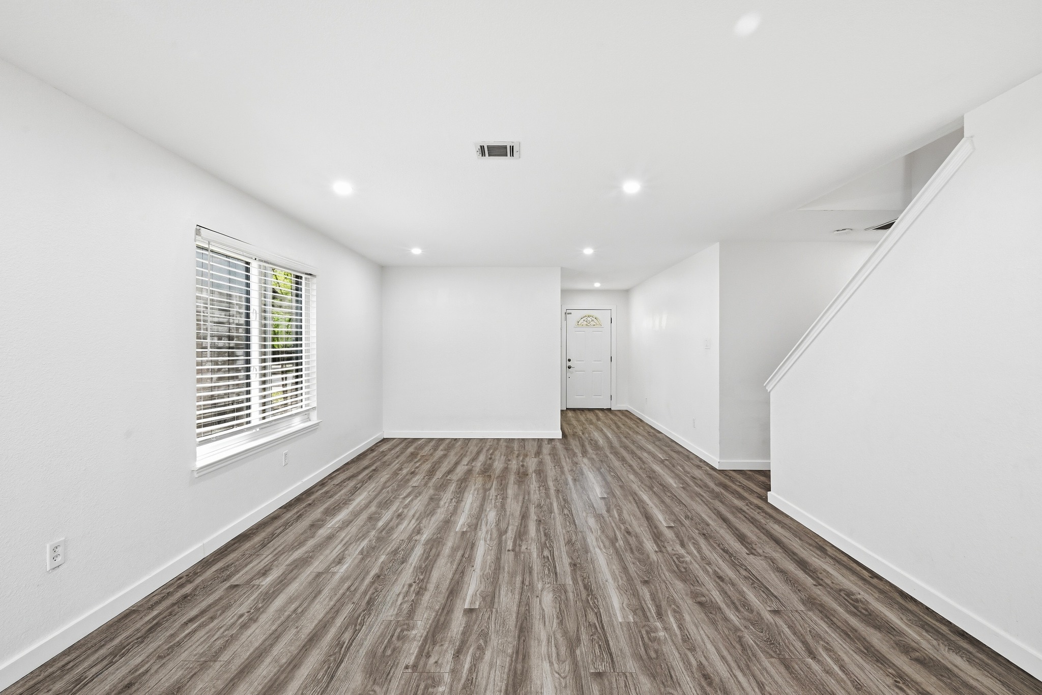5812 Kayview Drive Austin, TX 78749 - Photo 6 of 31 a view of an empty room with wooden floor and a window