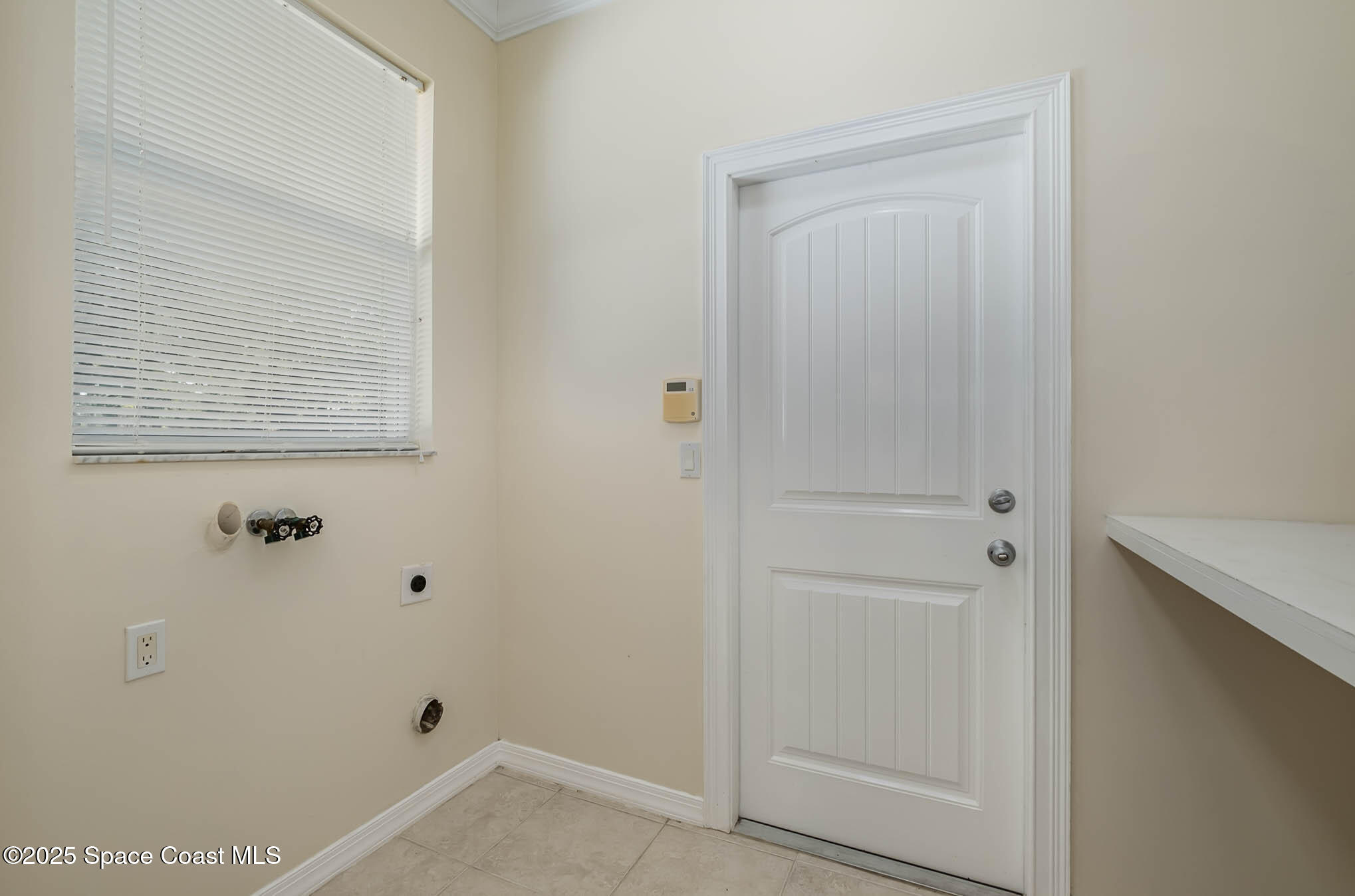 1233 Seeley Circle Northwest Palm Bay, FL 32907 - Photo 18 of 22 Inside Laundry