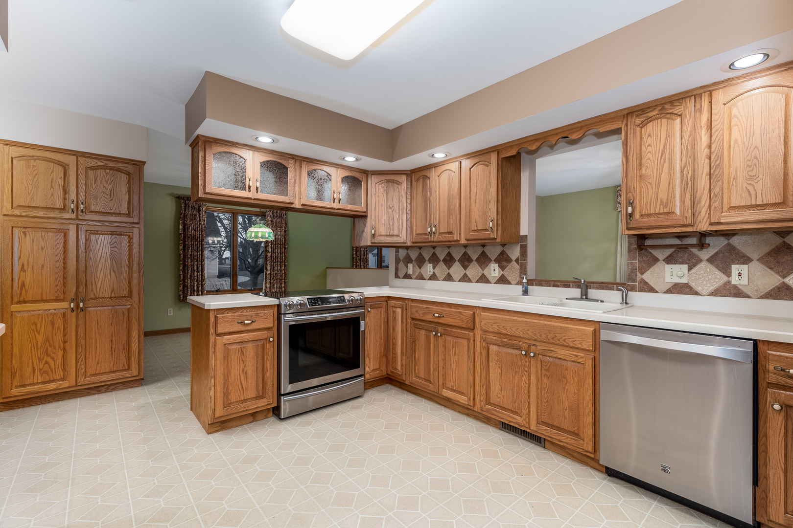 145 Porter Avenue Grand Ridge, IL 61325 - Photo 7 of 32 a kitchen with stainless steel appliances granite countertop a stove a sink and a refrigerator