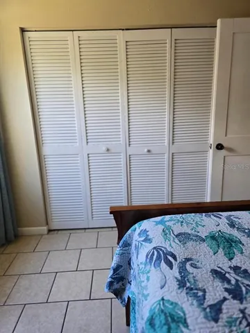 a view of a room with a wooden door