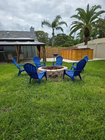 a view of a swimming pool with a lounge chair