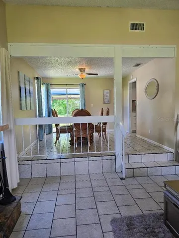 a view of a chairs and table in a room