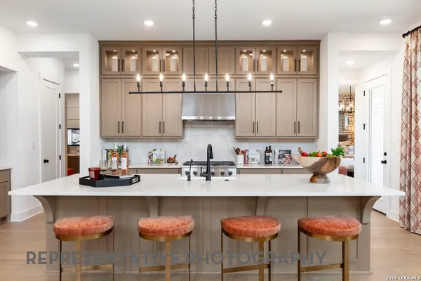 a kitchen with stainless steel appliances granite countertop a sink and cabinets