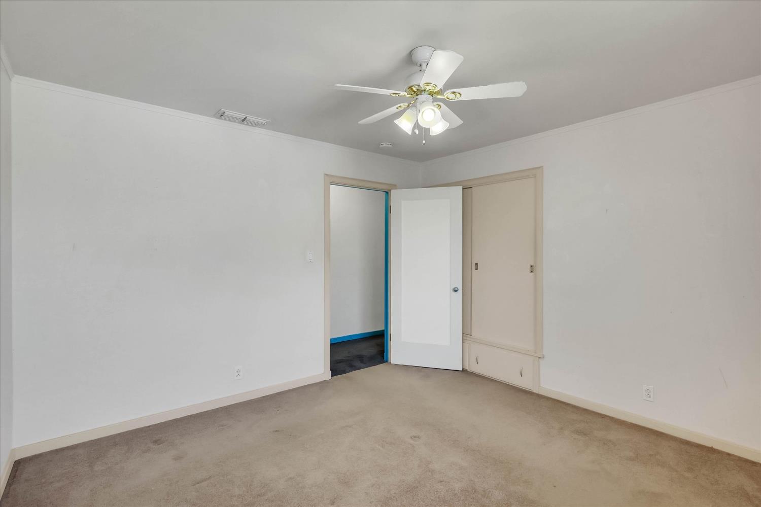 39640 South River Road Clarksburg, CA 95612 - Photo 21 of 25 a view of an empty room with a chandelier fan