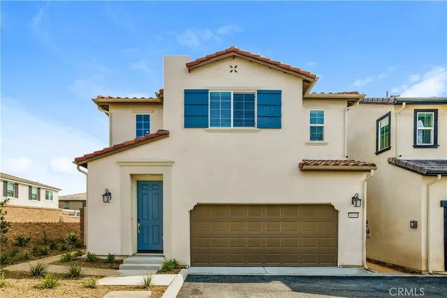 a front view of a house with a garage